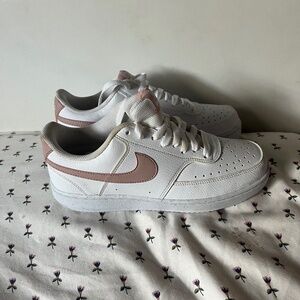 White and pink women Nike shoes